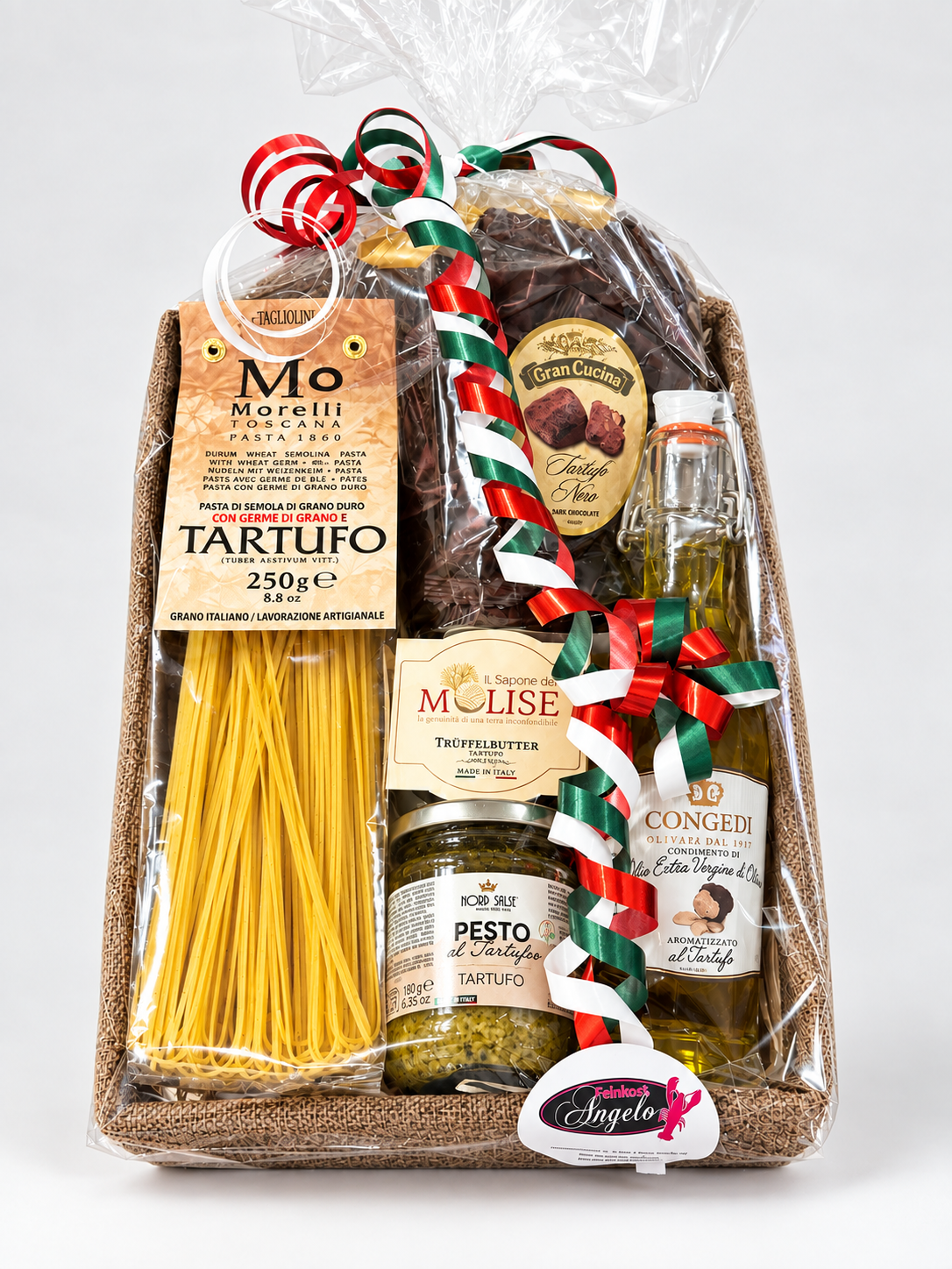 Il Cesto del Tartufo, der fertig gepackte Präsentkorb mit Trüffel-Spezialitäten, in Folie mit Schleife